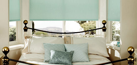 Roller blinds on a bay window